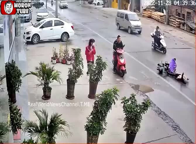 Video :No one helps her when she appears to be having an epileptic seizure after falling from her scooter